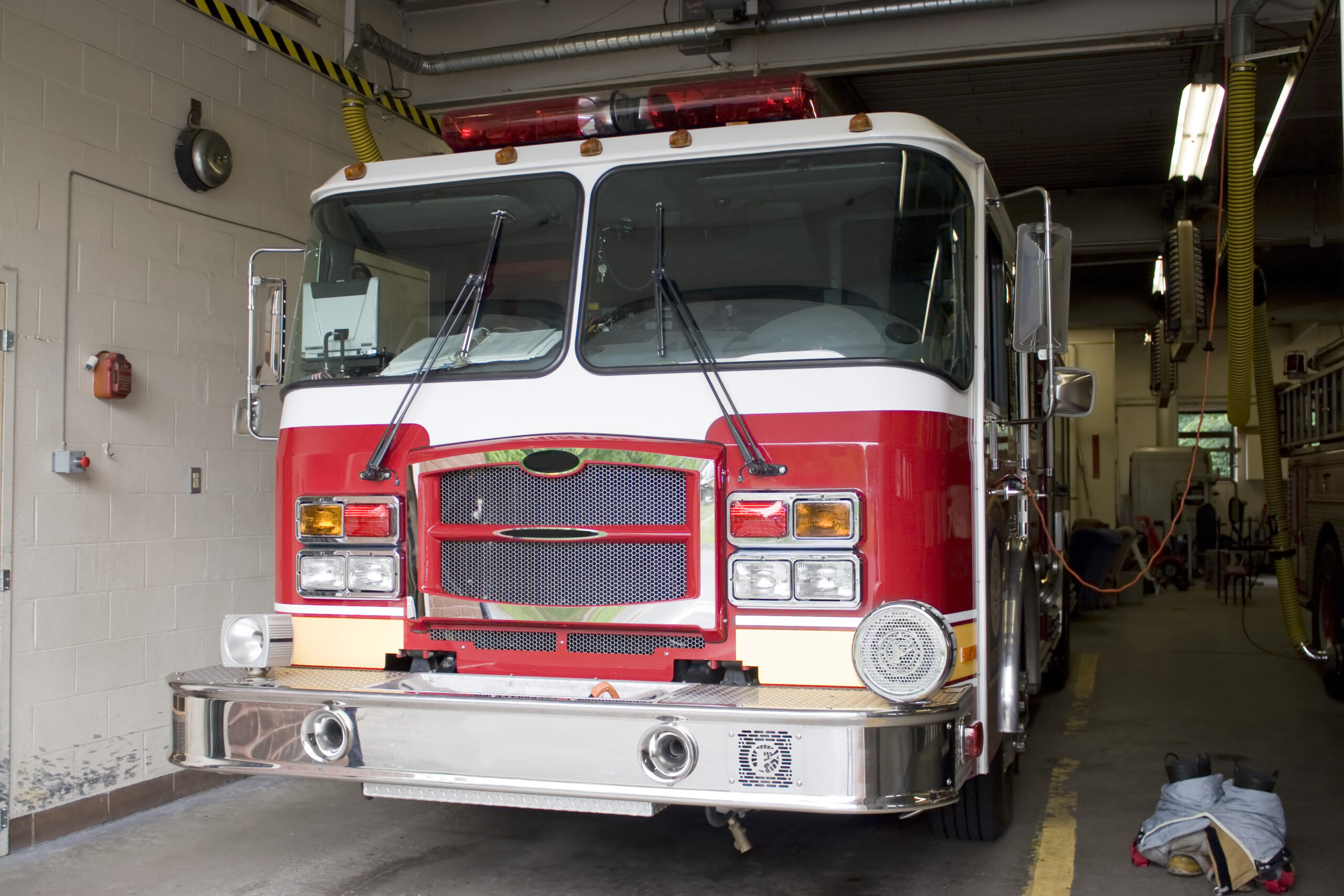 Building Resilience: The Importance of Disaster Preparedness in Uncertain Times 2 a fire truck is parked in the bay with all of the fire fighting equipment and gear ready to go HFxx4F8Ars scaled