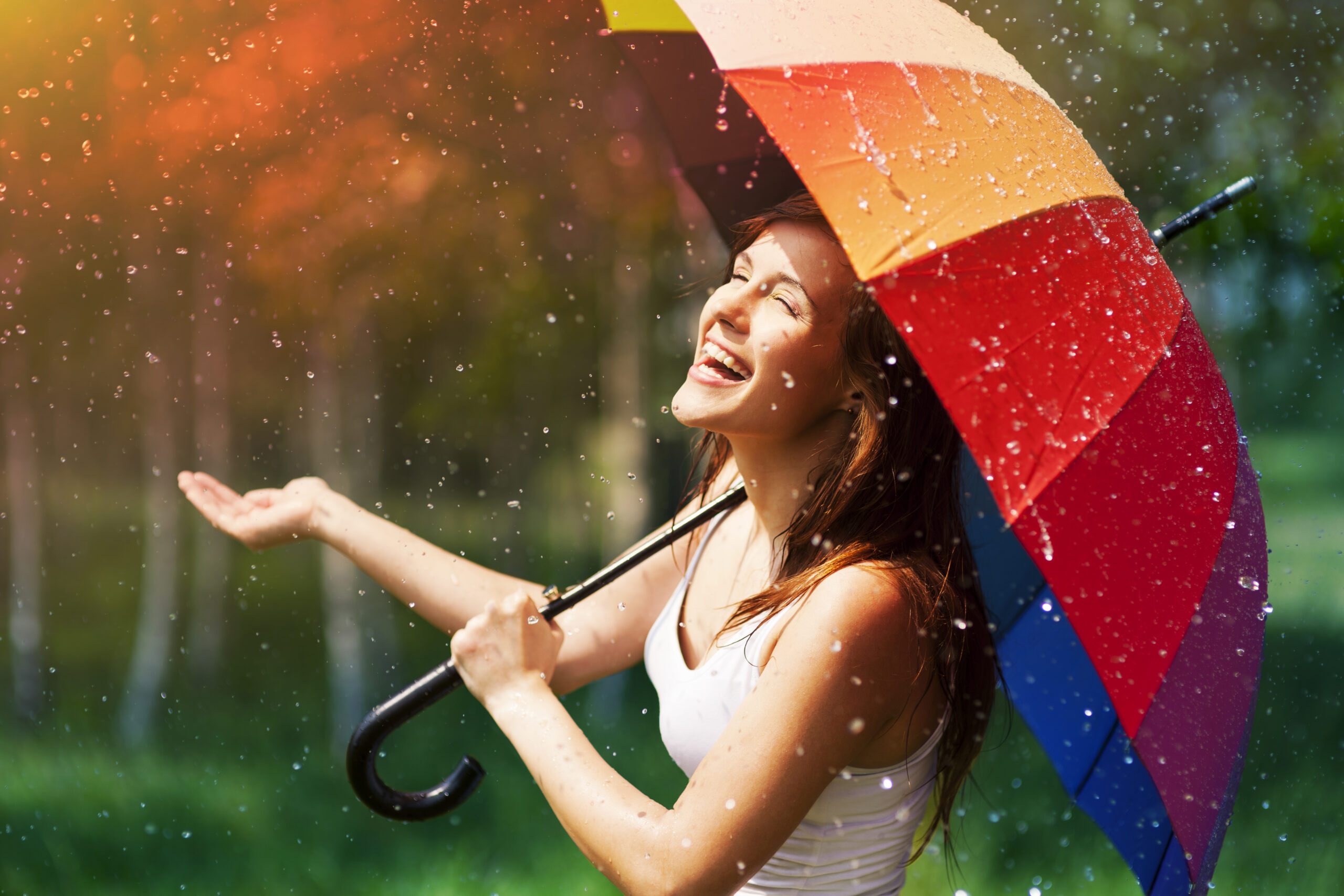 storyblocks laughing woman with umbrella checking for rain r xfOn6DqM scaled